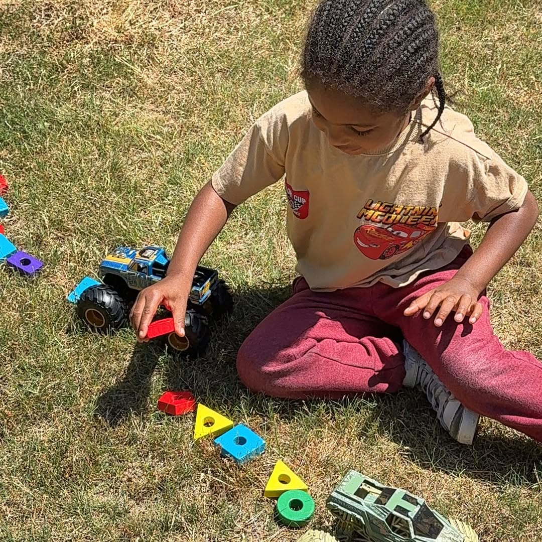 A child learning through outdoor play